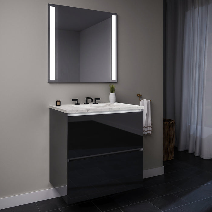 Curated Cartesian 30" x 15" x 21" two drawer vanity in tinted gray mirror glass with slow-close plumbing drawer, full drawer, night light and Engineered Stone 31" vanity top in Silestone lyra