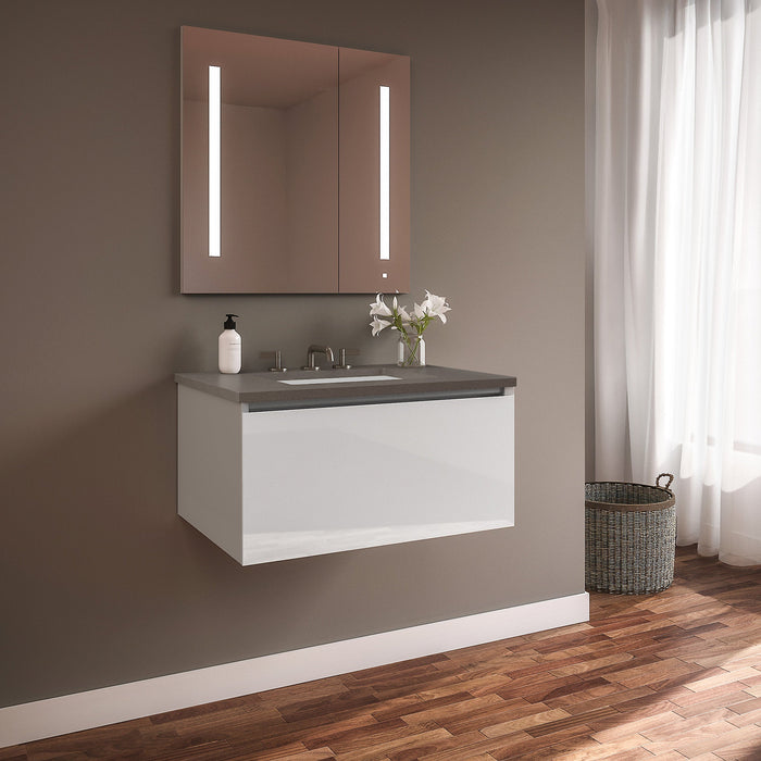 Curated Cartesian 30" x 15" x 21" single drawer vanity in white glass with slow-close plumbing drawer and Engineered Stone 31" vanity top in stone gray (Silestone expo grey)