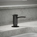 KOHLER K-1895-C Contemporary Design Soap/lotion Dispenser, Matte Black - Shows close up detail of product in room